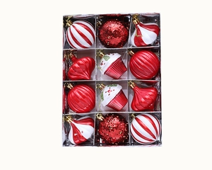 Detail view of 12-pack red and white Christmas ornaments set in silver display box