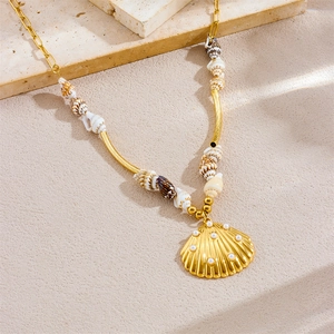 Golden tropical necklace with natural shells and a pearl-encrusted scallop shell pendant