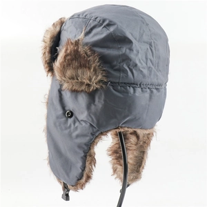 Detail of gray winter trapper hat showing faux fur lining and ear flap button closure