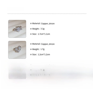 Detailed macro view of silver zircon ear cuffs with heart and star shapes for women