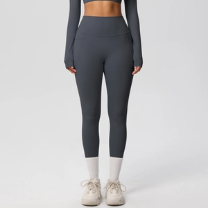 Detail view of high waisted charcoal yoga leggings with functional side pockets and matte texture