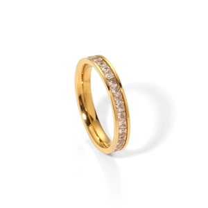 Close-up of golden titanium eternity ring with square cubic zirconia inlays