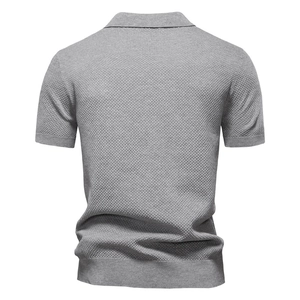 Macro shot of high-quality light grey waffle knit fabric texture on men's polo shirt