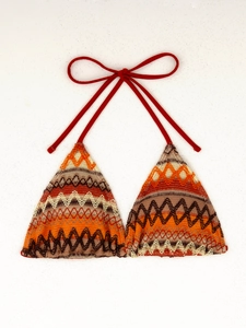 Detail of bohemian crochet bikini top with colorful zigzag patterns and red neck ties
