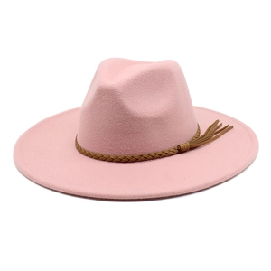 Close-up of pink wool fedora hat with brown braided leather band and fringe tassels