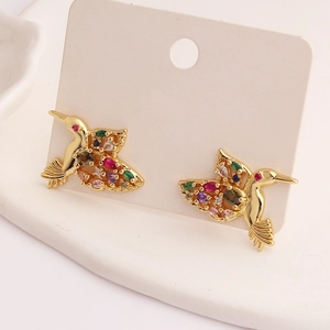 Elegant gold hummingbird earrings set with colorful zircon stones on display card