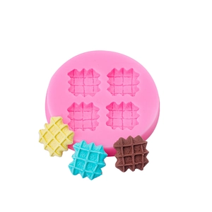 Pink 4-cavity silicone waffle mold for cookies, chocolate, and wax melts with samples