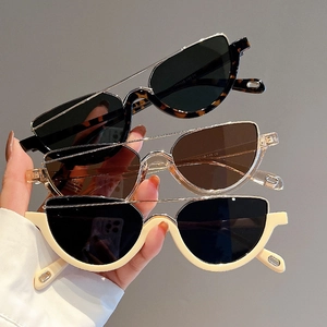 Three pairs of half-frame cat eye sunglasses in tortoiseshell and beige with metal bridges