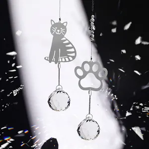 Cat and paw print wind chime suncatchers with crystal balls reflecting rainbow light