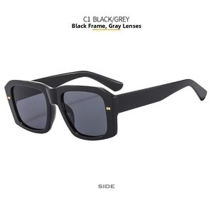 Detail view of black square frame sunglasses with golden metal accents on the side
