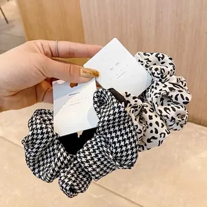 Elegant set of two large scrunchies in stylish houndstooth and leopard print patterns