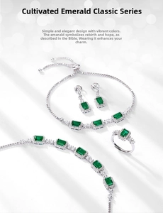 Macro shot of square emerald silver jewelry set with halo design and halo cut gems