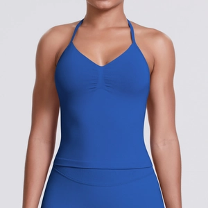 Detail of royal blue halter sports bra with v-neckline and pleated front for yoga