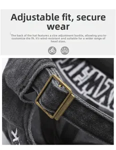 Detail of adjustable bronze metal buckle on dark grey vintage washed baseball cap