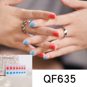 Close-up of QF635 gradient pink and blue waterproof nail art stickers on hand