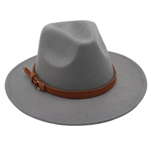 Close-up of a gray wool fedora hat featuring a brown leather band and gold buckle detail