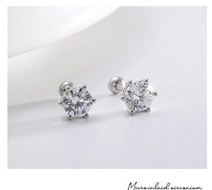 Close-up of S925 silver star stud earrings with large six-prong set zircon stones