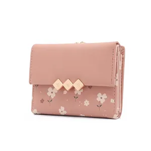 Floral print mini bifold wallet for women in soft pink with golden diamond accents
