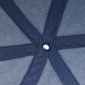 Detail of the reinforced inner crown with metal rivet and navy blue twill fabric