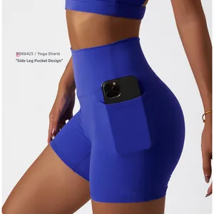 Detail view of high waisted yoga shorts in navy blue with functional side pocket design