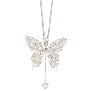 Macro detail of silver butterfly car pendant with sparkling iridescent crystals