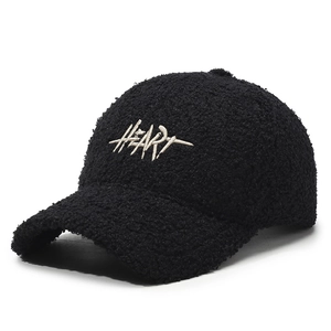 Black faux shearling baseball cap with HEART embroidery and warm fleece texture