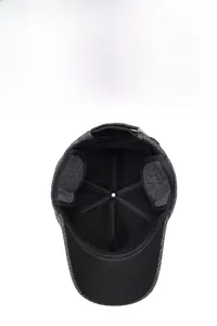 Close-up of thick fleece lining and ear protection flaps on a grey winter cap