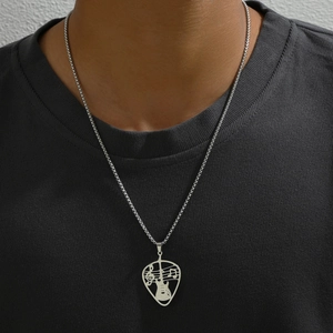 Silver guitar pick pendant necklace with heart and music note cutout on a link chain