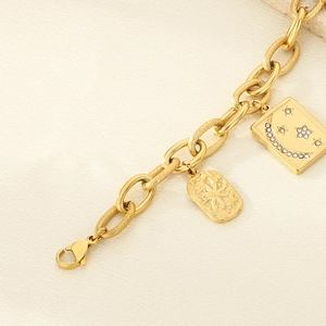 18K gold plated celestial charm bracelet with moon and star pendants on textured links