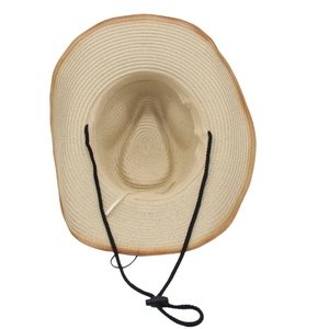 Detail of woven straw sun hat with dark brown trim and adjustable black windproof chin strap