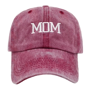 Close-up of vintage washed cotton baseball cap featuring white MOM embroidery and distressed texture