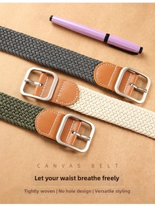 Close-up of woven canvas belts in gray, beige and green with square metal buckles
