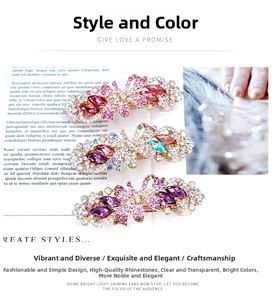 Detailed view of floral crystal hair clips with colorful rhinestones on a magazine background