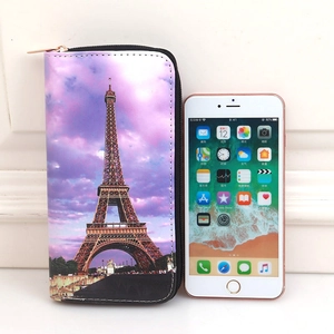 Long zipper wallet with Eiffel Tower sunset print and size comparison to a mobile phone