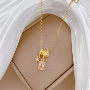 Luxurious gold titanium steel necklace with pink gemstone pendant and sparkling diamonds