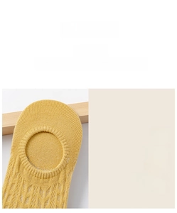 Detail view of ginger yellow mesh boat socks showing the flexible elastic ankle cuff