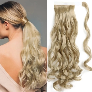 Detail of blonde wavy ponytail extension showing velcro wrap-around design and texture