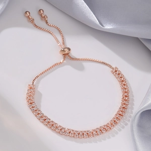 Detail of rose gold double-row crystal tennis bracelet with adjustable bolo pull-string clasp