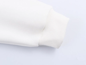 Detailed macro view of white sweatshirt ribbed cuffs and high-quality fabric texture