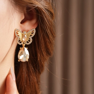 Détails de boucles d'oreilles papillon dorées vintage avec gouttes de cristal et strass