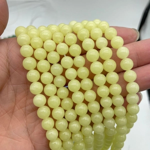 Luminous glow stone round beads in pale green for DIY jewelry making and crafting