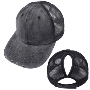Detail of grey washed denim ponytail baseball cap with breathable mesh and distressed brim