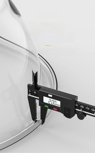 Macro shot of a 2.00mm thick handle on a transparent plastic basin using digital calipers