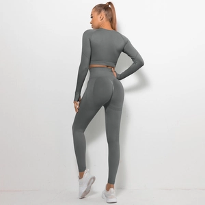 Rear view of seamless high-waist yoga set with ribbed details and long sleeve crop top