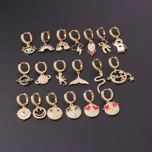 Gold plated hoop earrings with micro zircon charms including eye, rainbow and astronaut