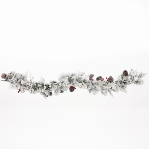 Frosted Christmas garland with snow-flocked pine needles, red berries and pinecones