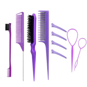 Detailed view of professional purple hair styling comb and brush set on white background