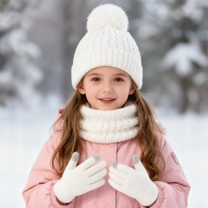 Detailed knit texture of white winter beanie with pom pom, scarf and gloves set for kids