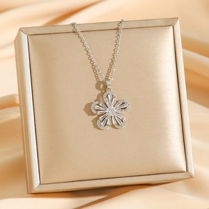 Elegant silver flower pendant necklace with clear zircons on champagne silk satin