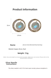 Macro view of mermaid pearl earrings with cubic zirconia and 2cm by 1.9cm dimensions